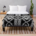 Monochrome geometric Aztec-inspired plush blanket