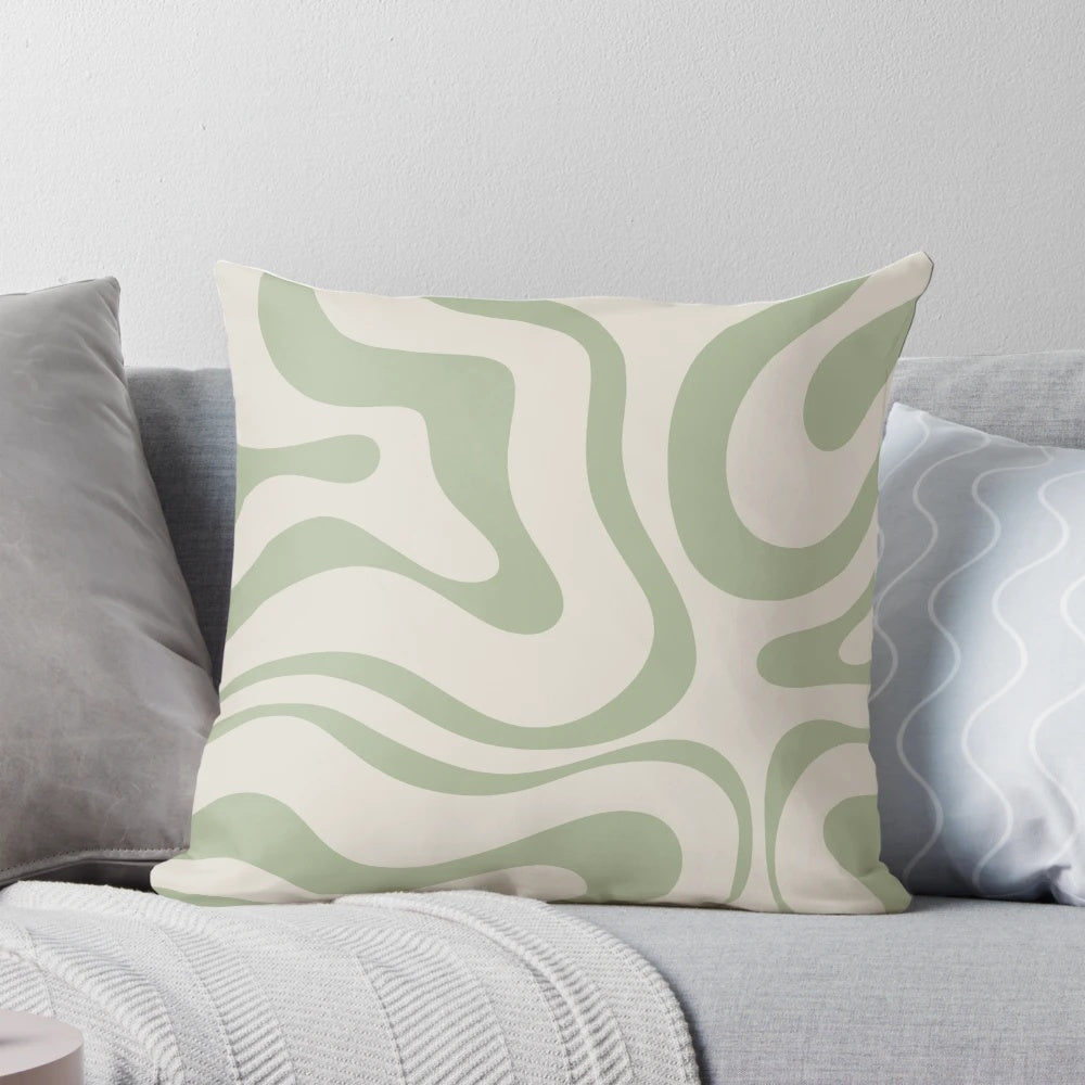Minimalist abstract swirl pattern pillow in beige and sage green colors