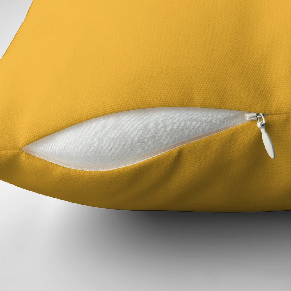 Minimalist color block pillow in soft blush pink and mustard yellow hues