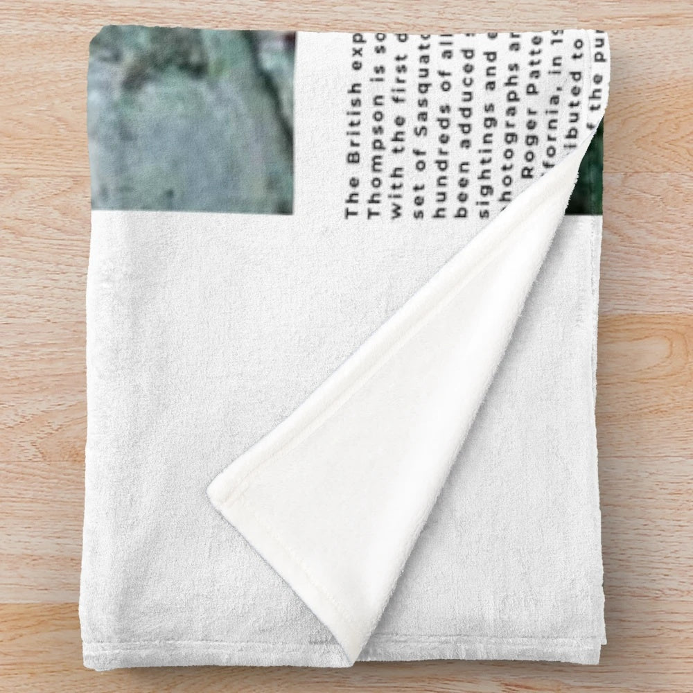 Minimalist Bigfoot plush blanket with a paranormal, supernatural aesthetic