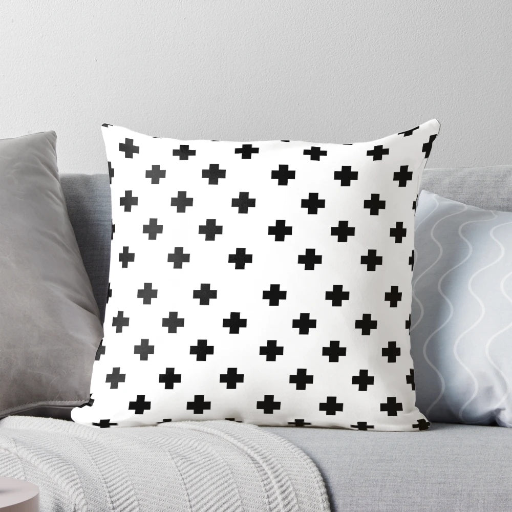 Black and white geometric Swiss cross pattern decorative pillow
