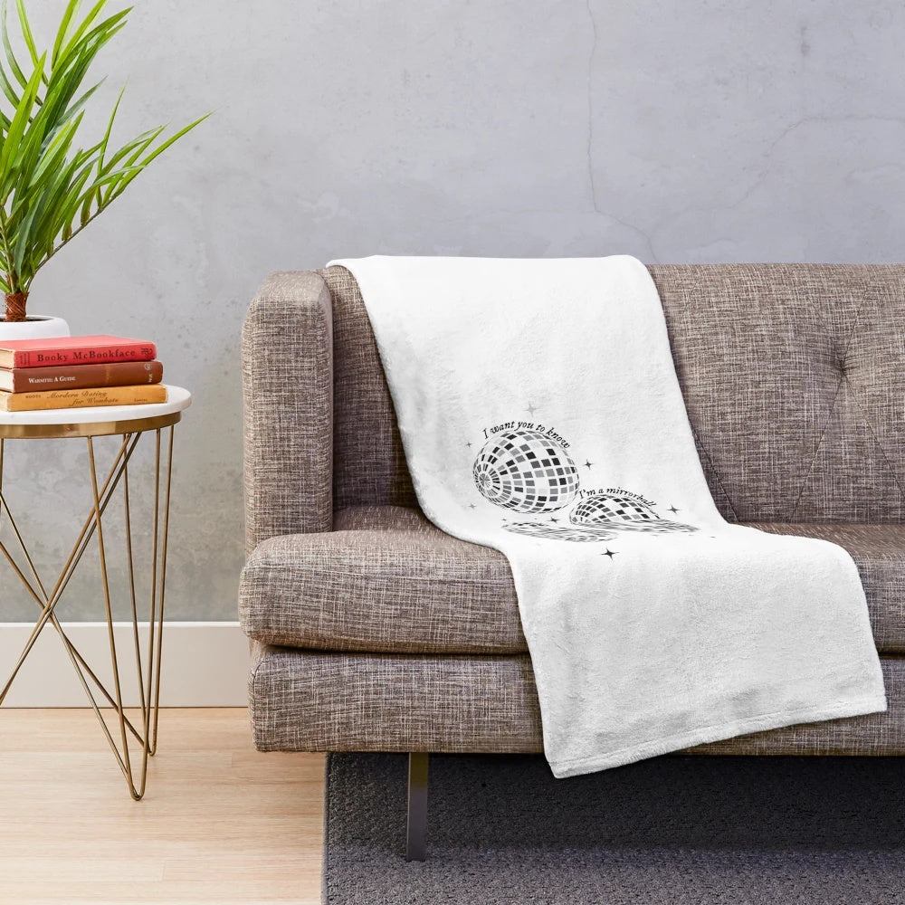 Mirrorball-inspired plush blanket with a shimmering disco ball design