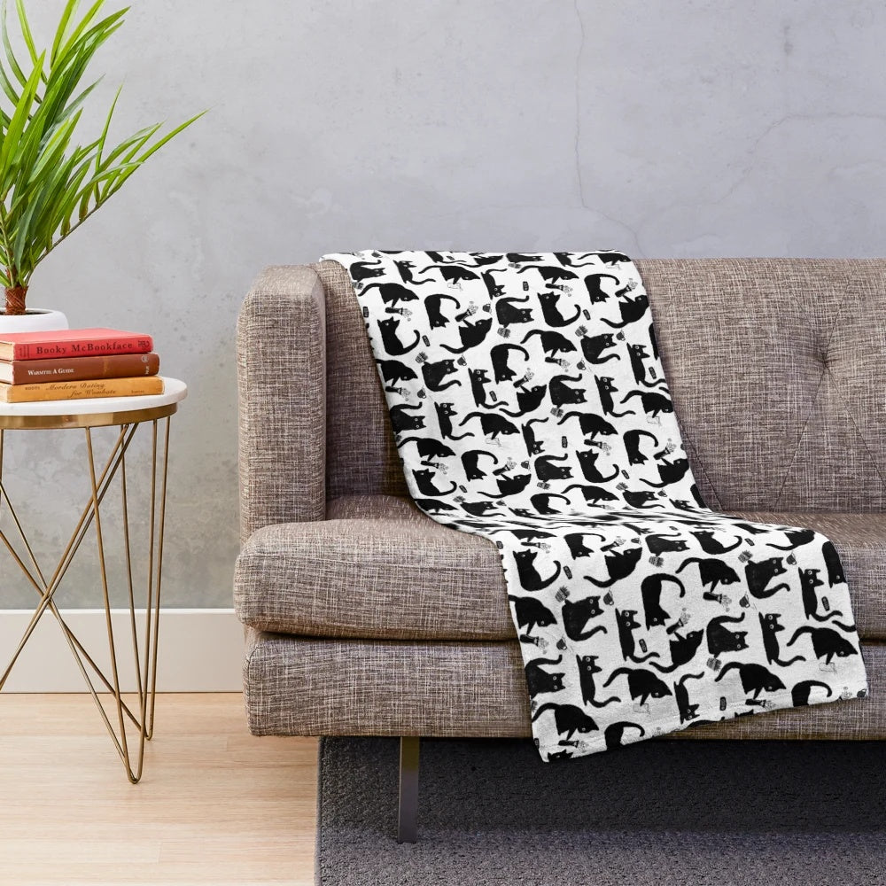 Mischievous cats silhouette pattern on a plush blanket
