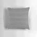 Black and white striped pillow with a modern, minimalist geometric design