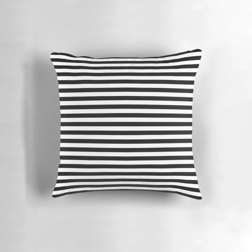Black and white striped pillow with a modern, minimalist geometric design