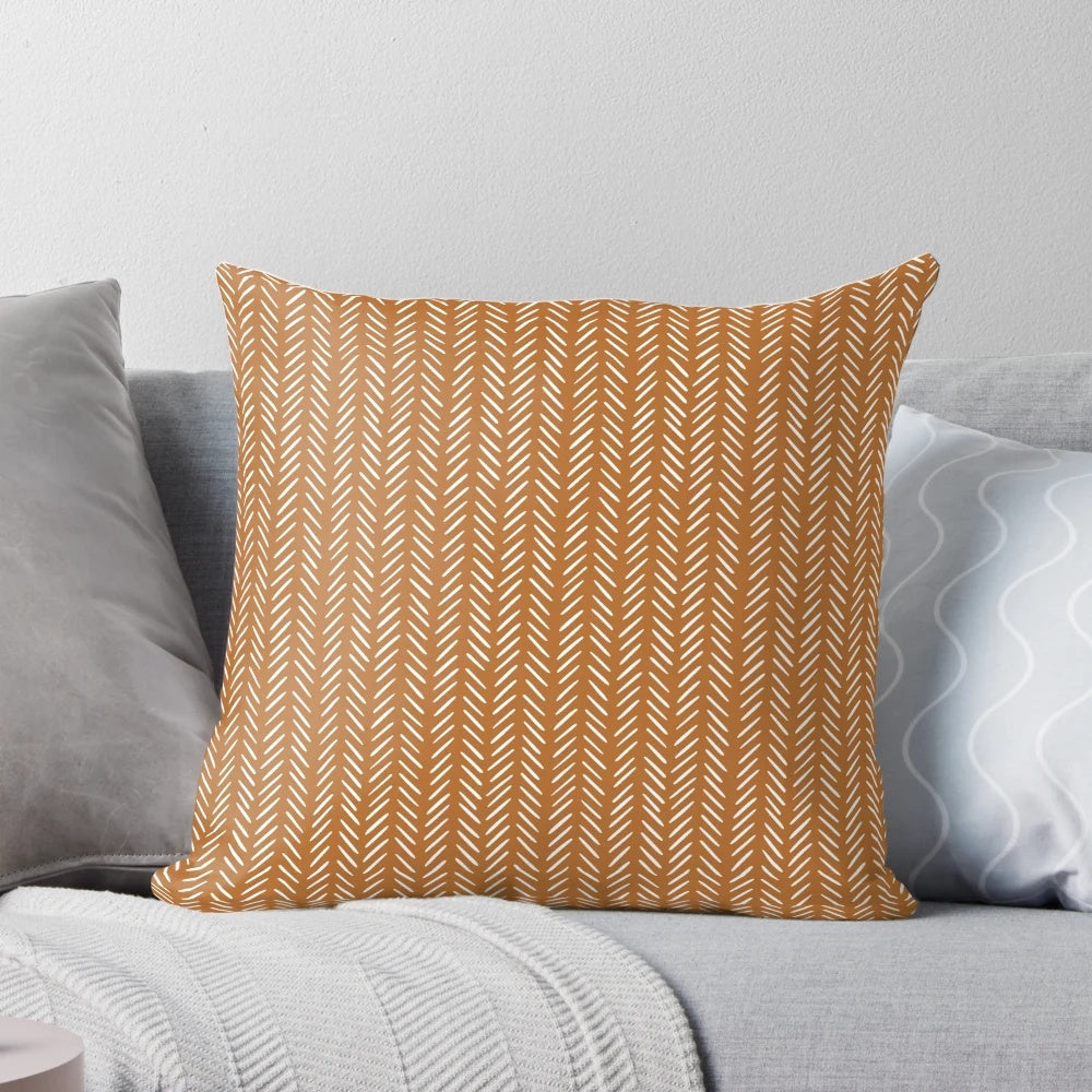 Modern boho chevron orange pillow with a cozy, stylish design for home decor.