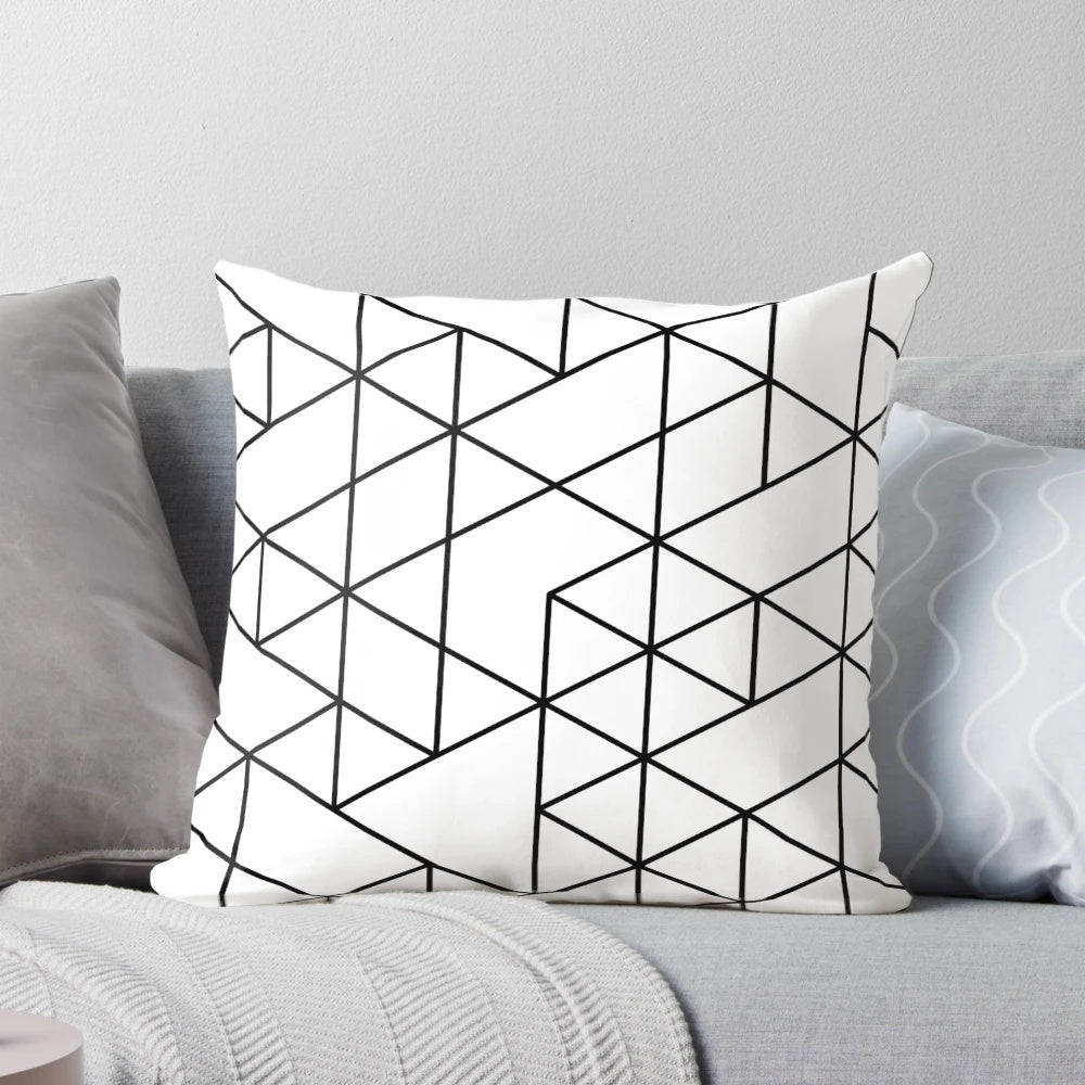 Black and white pillow with abstract triangular pattern, ideal for minimalist and Scandinavian-inspired home decor.