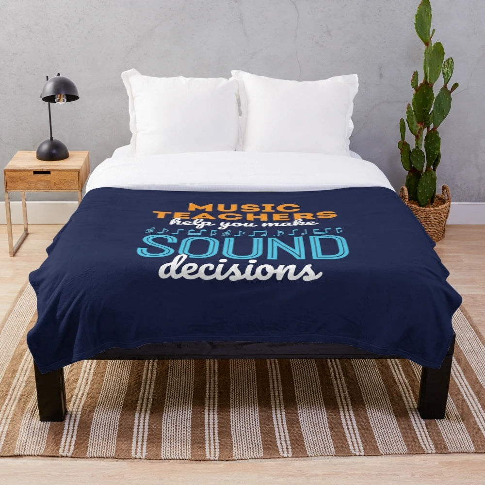 Music teacher-themed plush blanket with a pun about making sound decisions