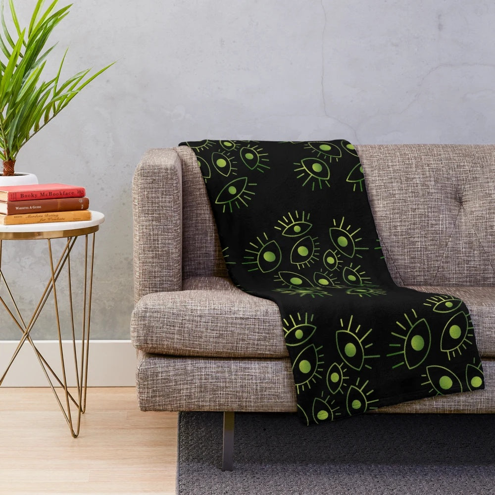 Plush blanket with a mysterious void and eyes design, inspired by cosmic horror