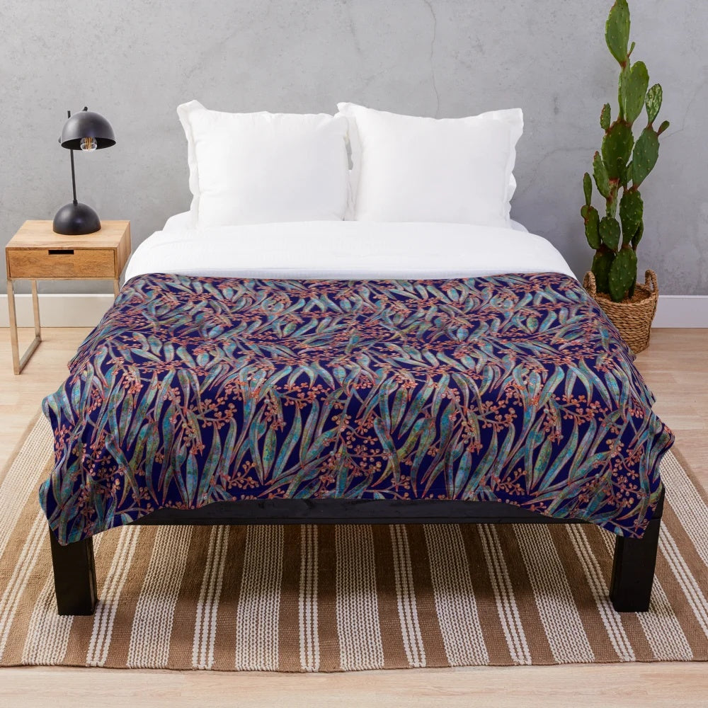 Mystical eucalyptus-inspired plush blanket with a blue and green botanical pattern