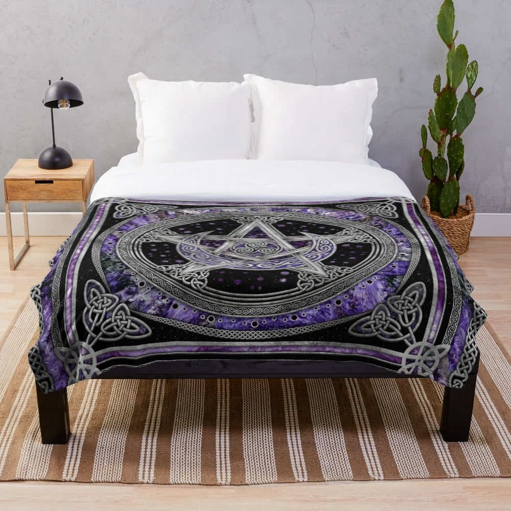 Purple plush blanket featuring sacred symbols like pentagram, triskelion, and triple moon