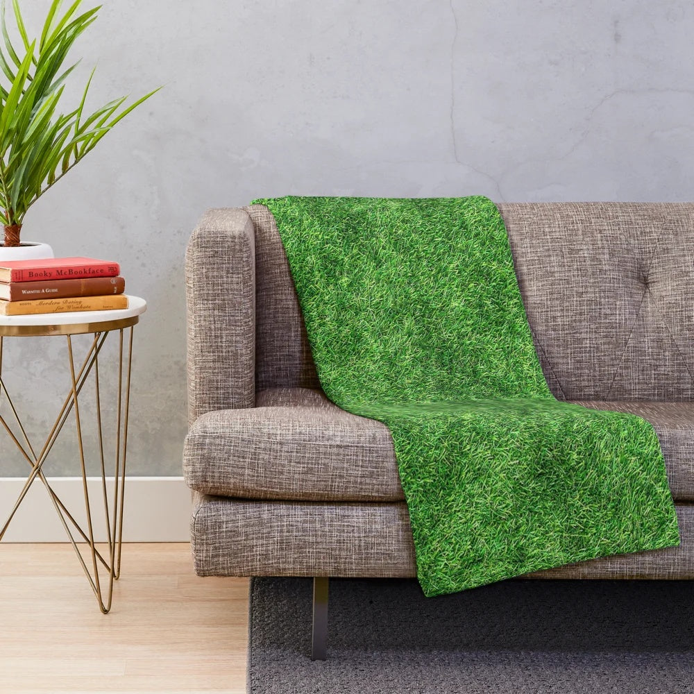 Soft and cozy plush blanket with a nature-inspired grass-like texture