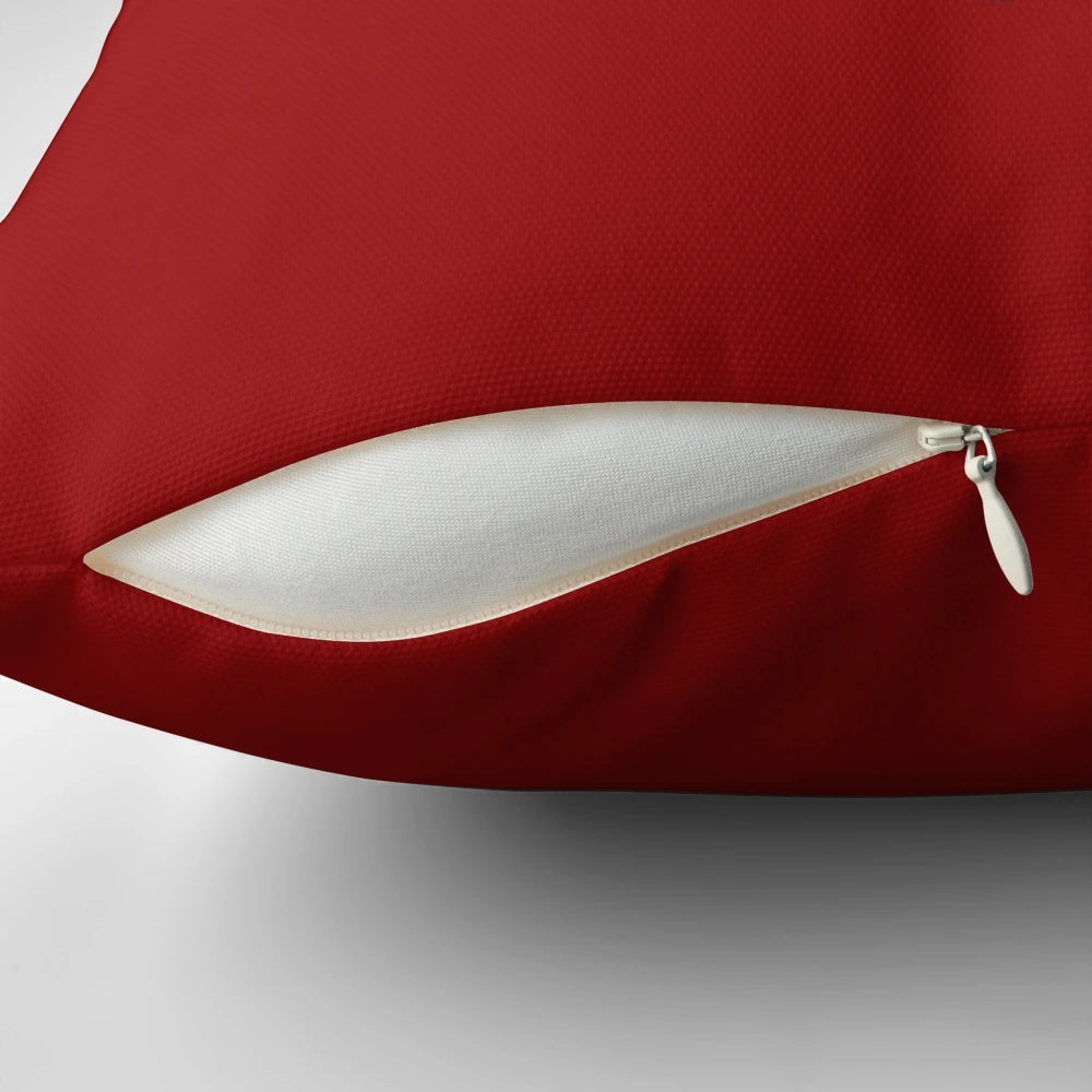 Decorative pillow with illustrations of vintage Hoover vacuum cleaners and their iconic characters