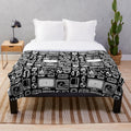 Retro gaming plush blanket featuring vintage video game consoles, controllers, and accessories