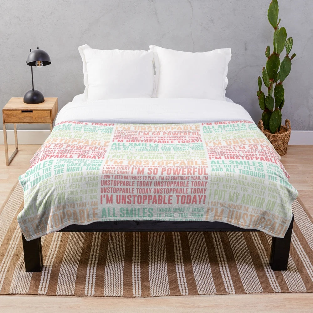 Pastel plush blanket with inspirational "Unstoppable" lyrics by Sia