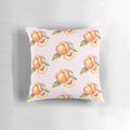 Peach pillow with leaves and a slice of peach on a white background