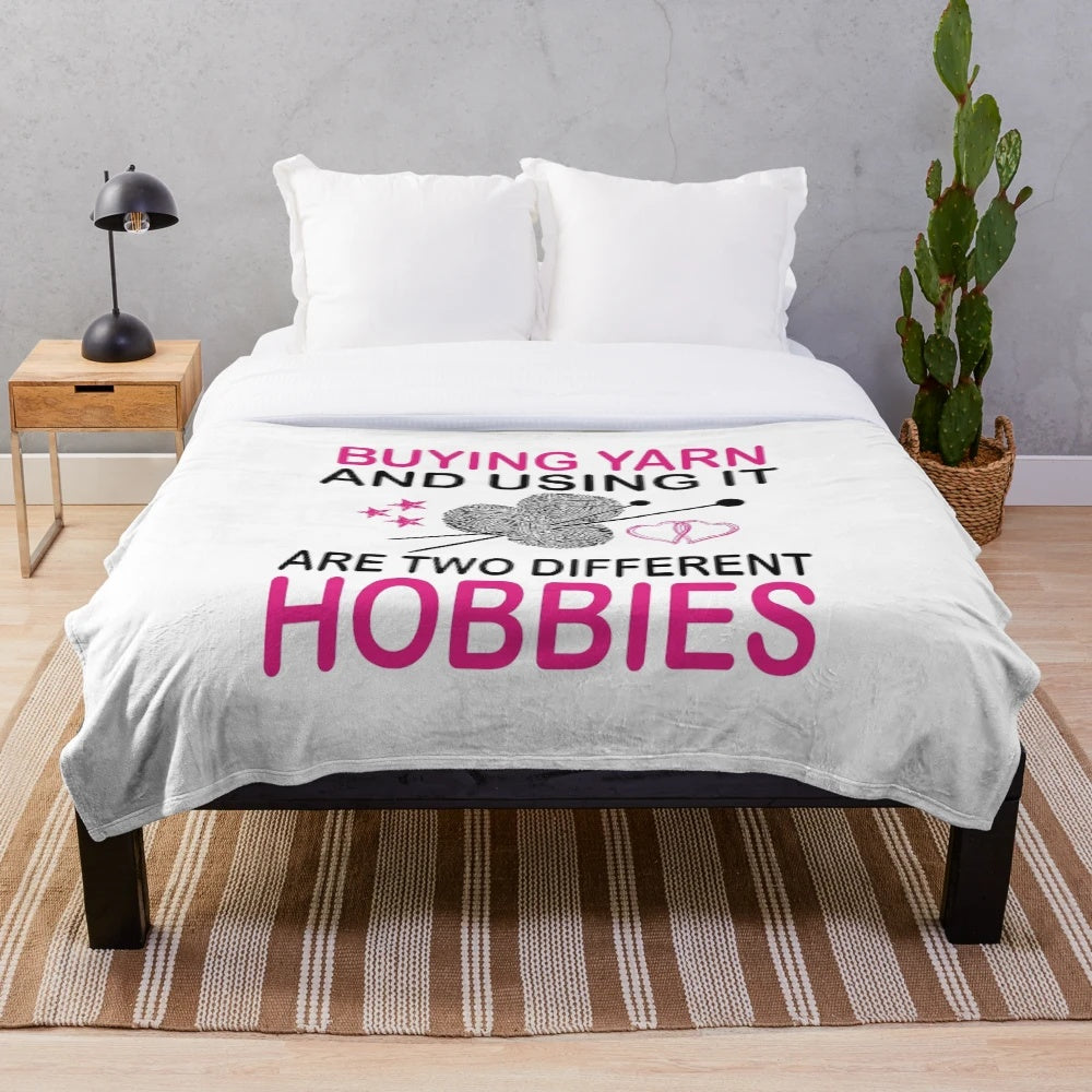 Plush blanket with text "Buying Yarn and Using It Are Two Different Hobbies" for knitting lovers