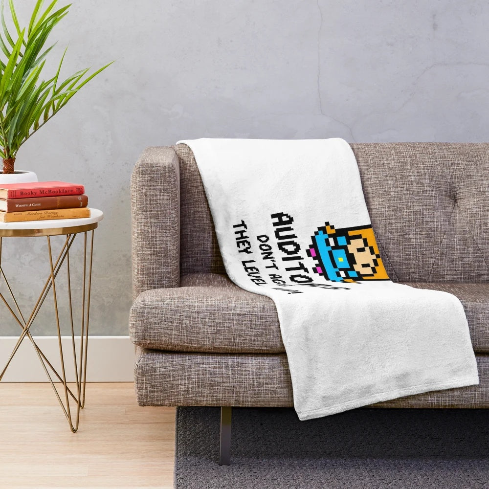 Plush blanket featuring an 8-bit style design with the text "Auditors don't age, they level up!