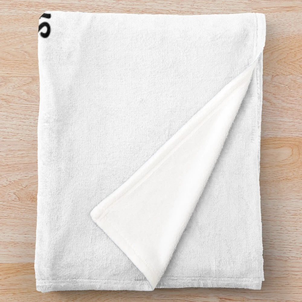 Plush blanket with text "A WOMAN CANNOT SURVIVE ON BOOKS ALONE SHE ALSO NEEDS CATS