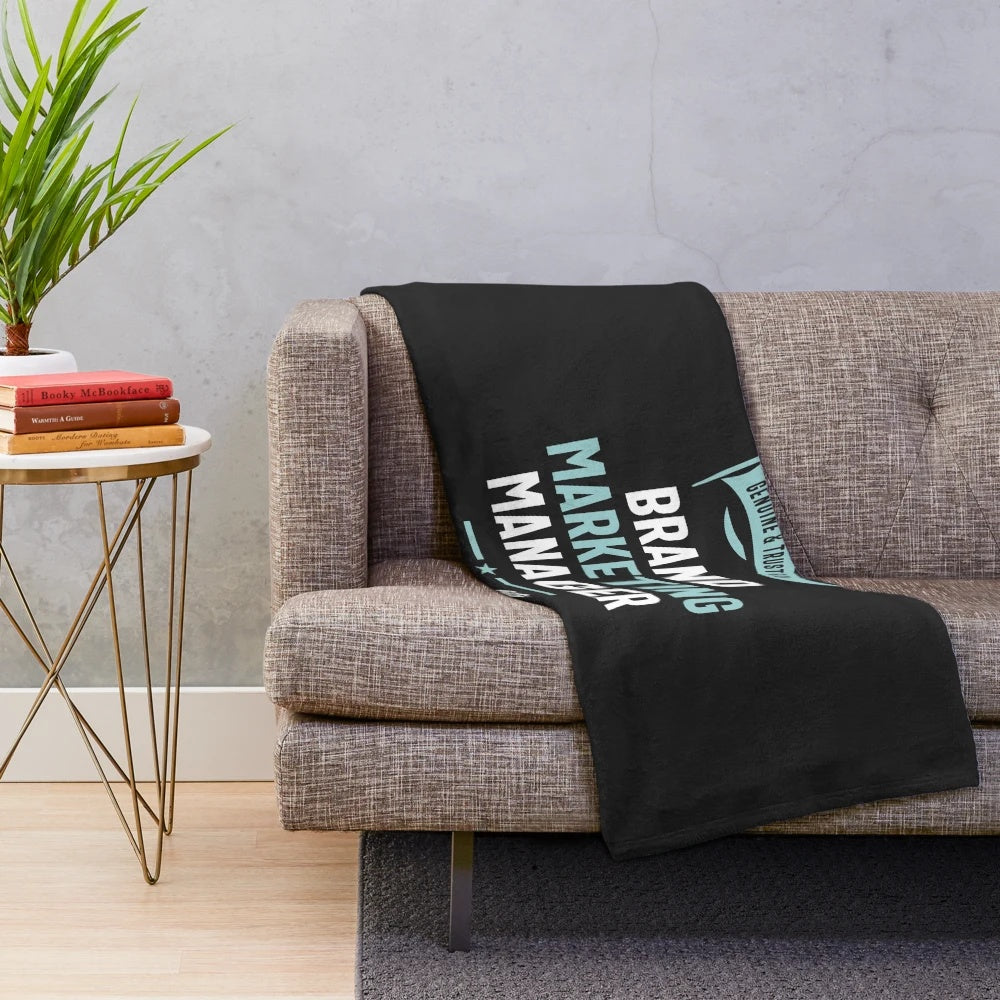Plush blanket with text "Brand Marketing Manager