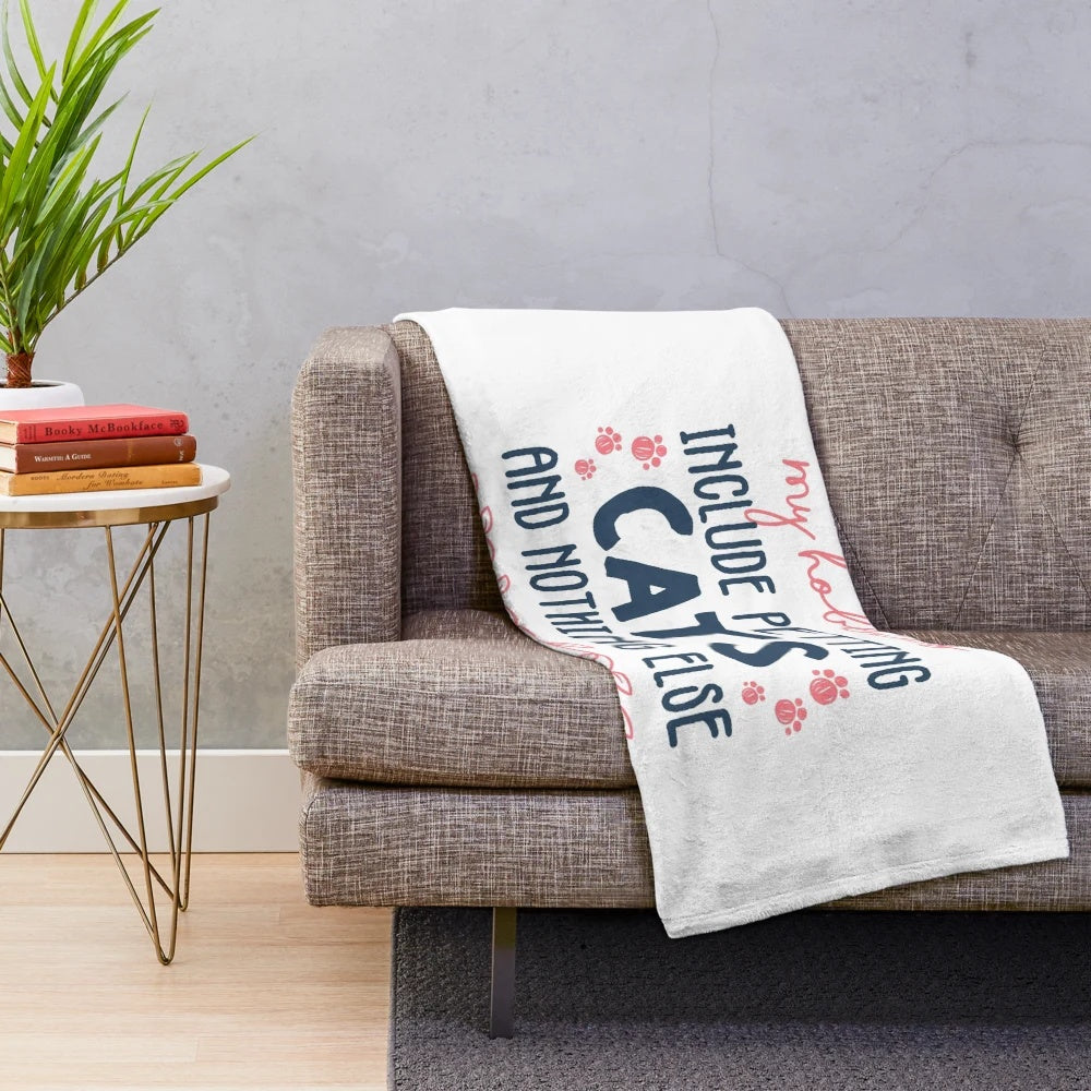 Plush blanket with the text "My hobbies include petting cats and nothing else