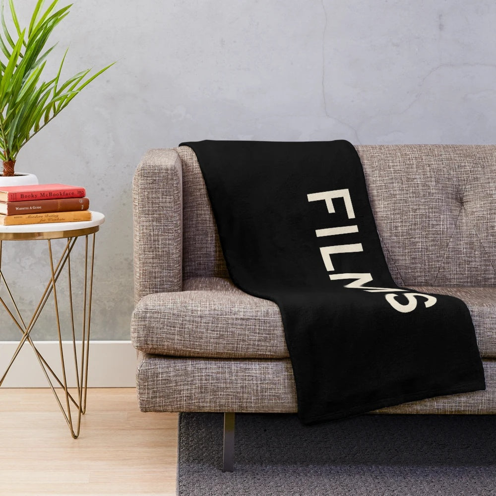 Plush blanket featuring a collage of film, hobby, and passion-related icons