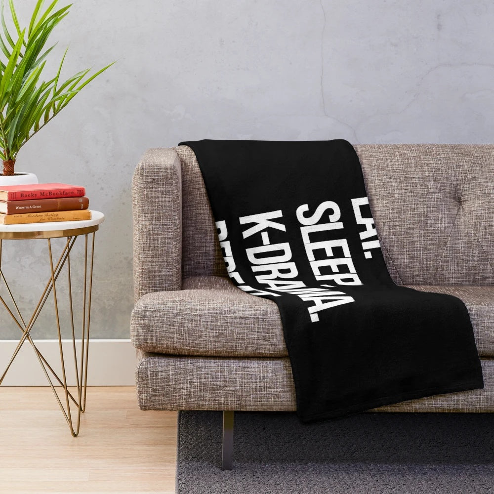 Plush blanket with "Eat Sleep K-Drama Repeat" design, perfect for Korean drama fans