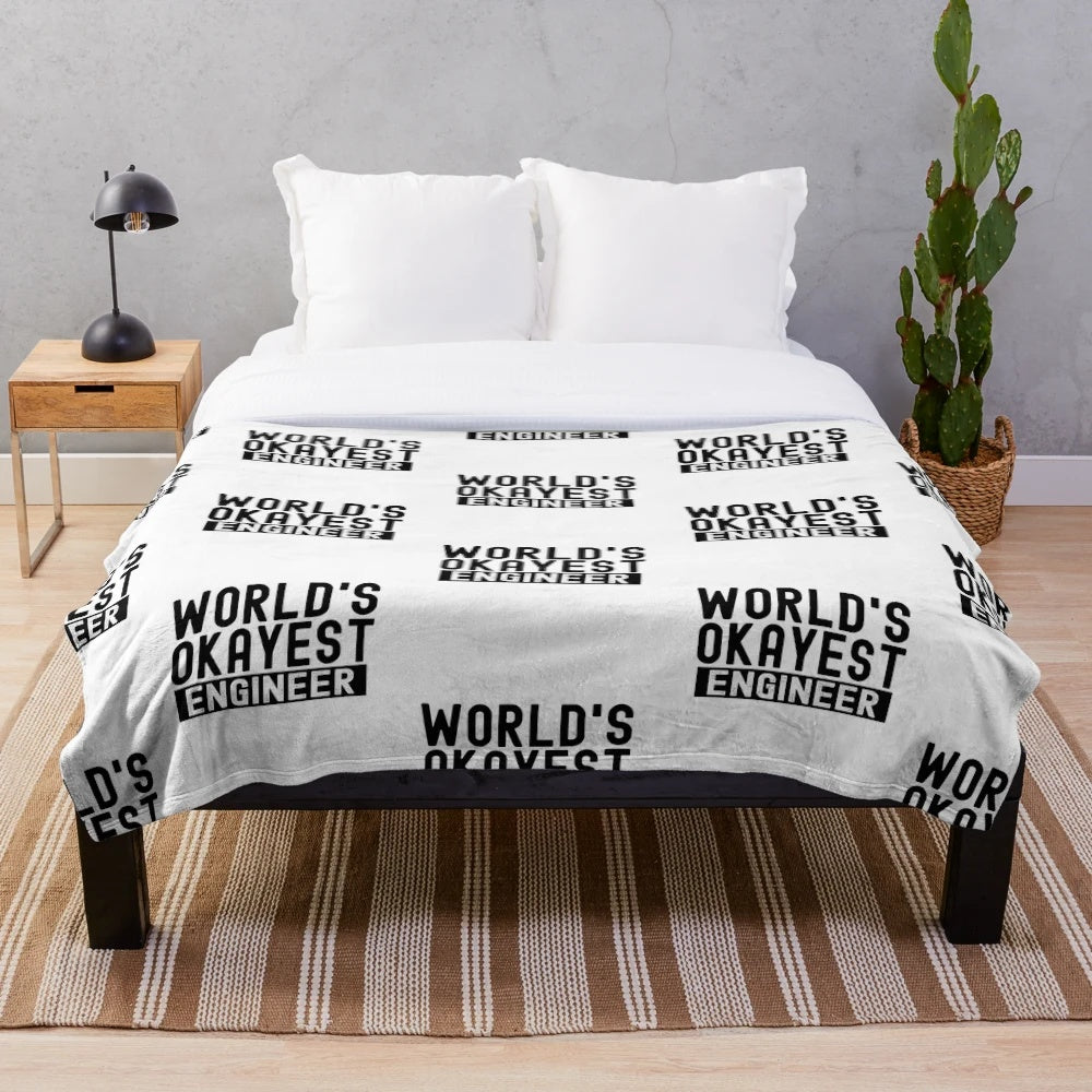 Plush blanket with the text 'World's Okayest Engineer