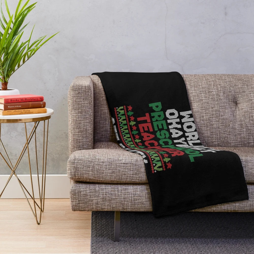 Plush blanket with the text "World's Okayest Preschool Teacher Off Duty