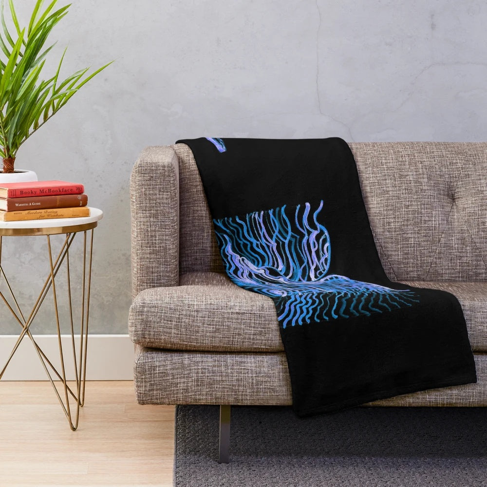 Plush blanket with underwater-inspired design for cozy relaxation