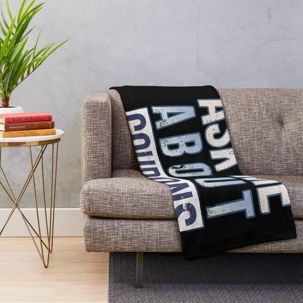 Plush blanket with "Ask Me About Coupons" design