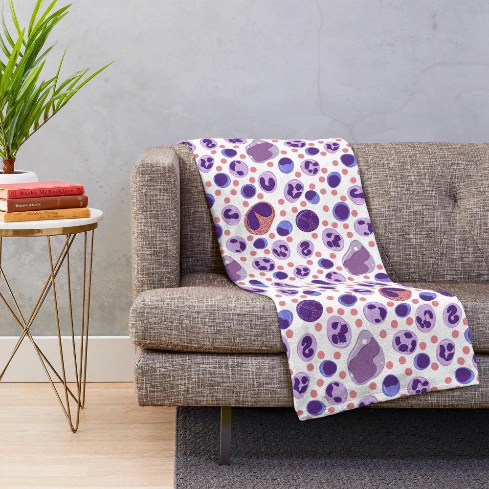 Plush blanket featuring a pattern of microscopic white blood cells