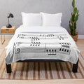 Plush blanket featuring musical notes design for rowing enthusiasts