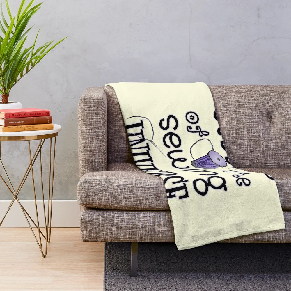 Plush sewing-themed blanket with a goddess of the sewing universe design