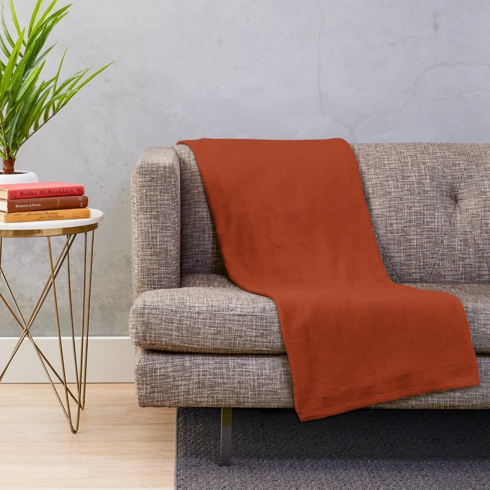 Plush burnt orange solid color blanket for cozy seasonal decor