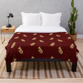 Cozy plush blanket with a tuba pattern design, perfect for music lovers
