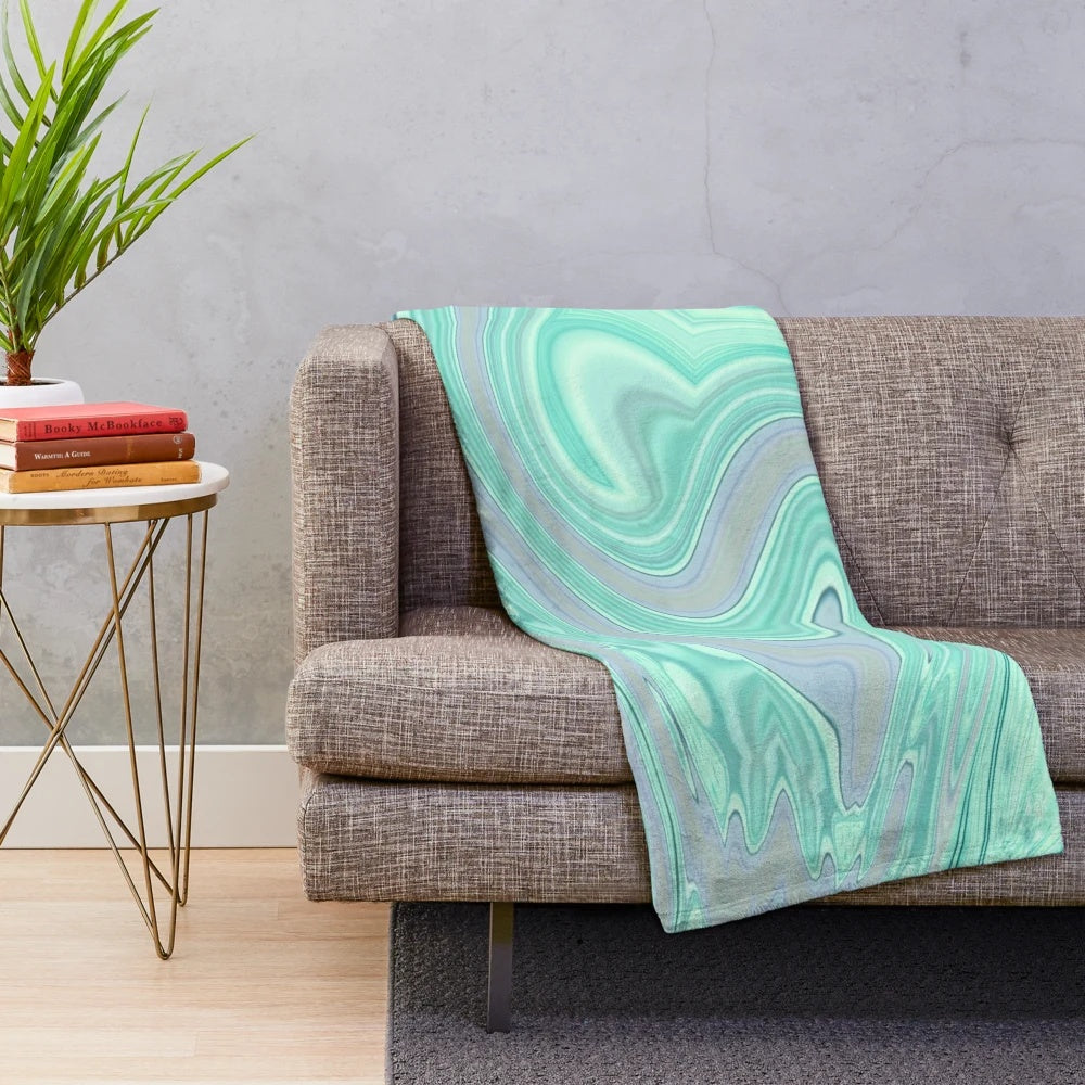 Mint green and pastel plush blanket with marble swirl pattern