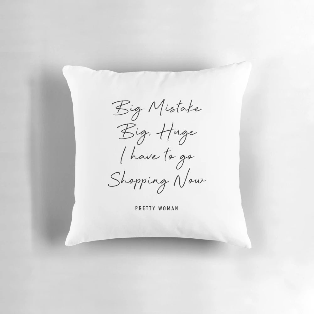 Decorative throw pillow with "Pretty Woman" movie quote about shopping and fashion