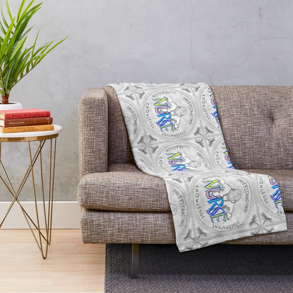 Plush blanket featuring a nursing caduceus design