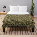 Puzzlebox Pattern Cozy Plush Blanket featuring a horror-inspired design