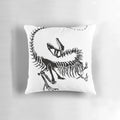 Realistic print of a velociraptor dinosaur skeleton on a decorative throw pillow.