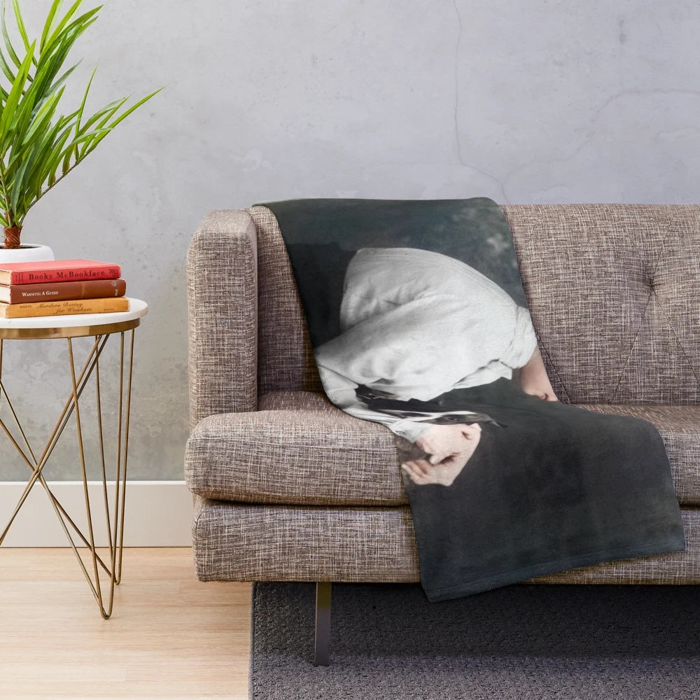 Colorized image of Helen Keller and her guide dog on a plush blanket