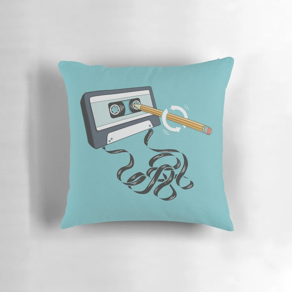 A blue and teal retro 80s cassette tape shaped pillow, a nostalgic home accessory for music lovers.