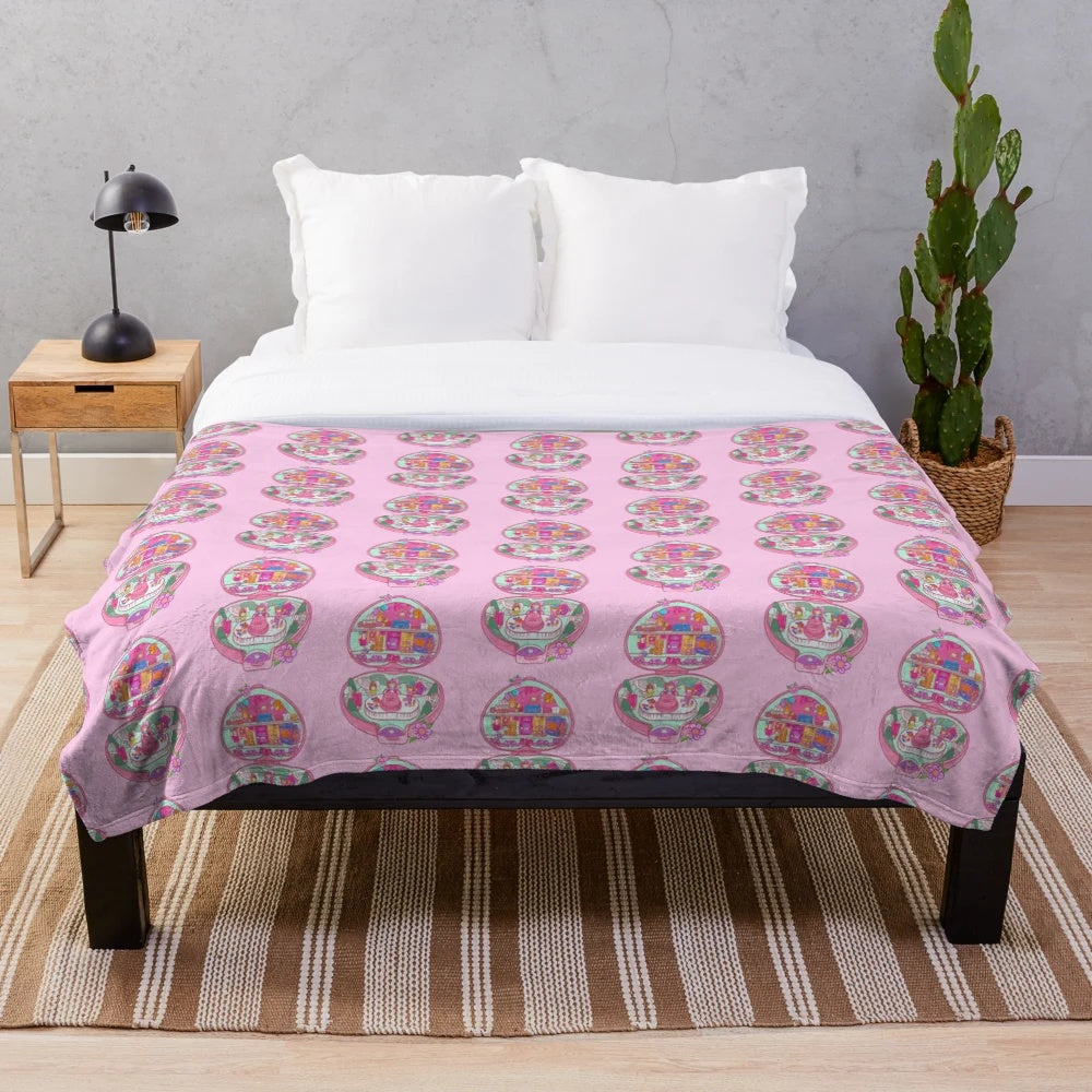 Retro 90s Polly Pocket themed plush blanket with birthday party decorations