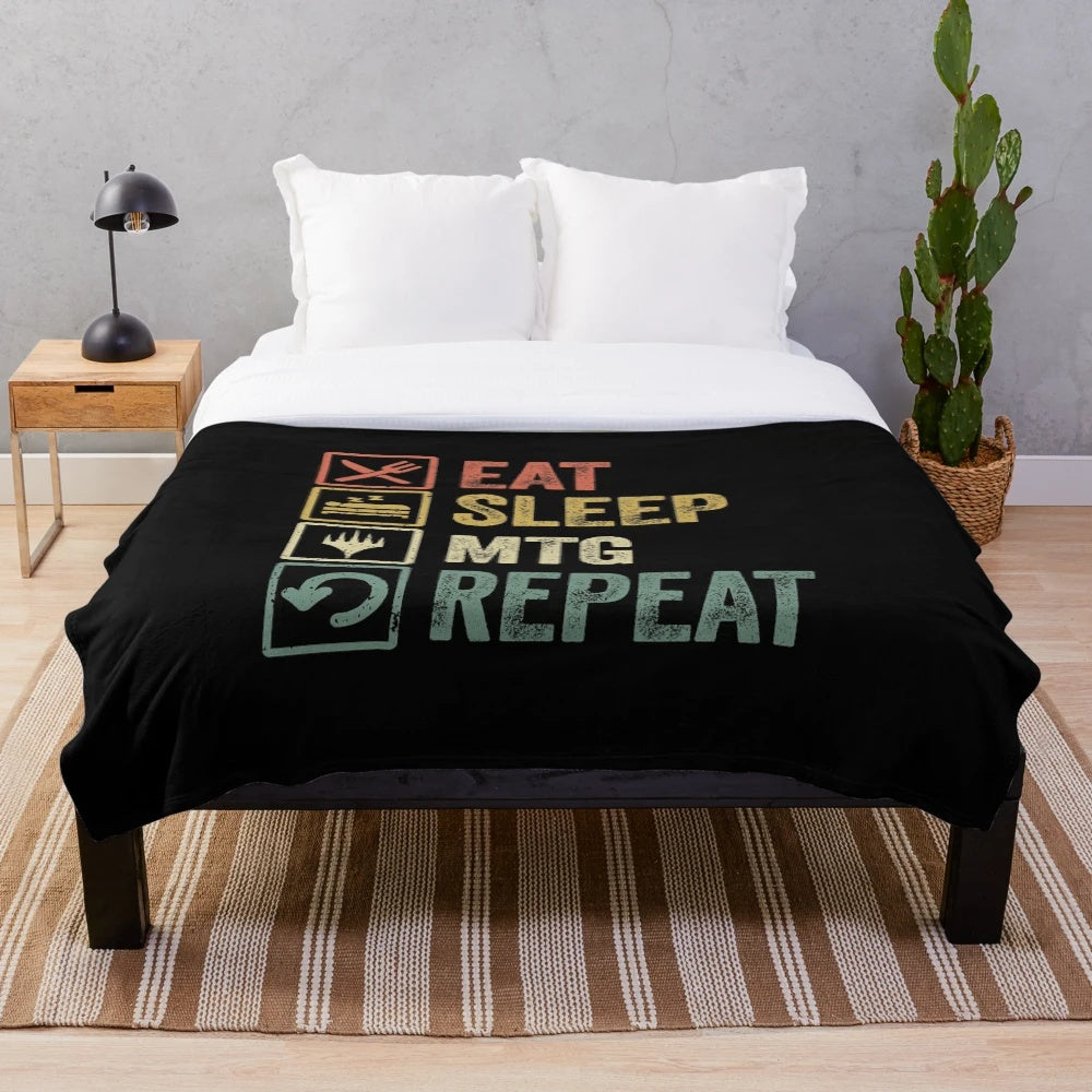 Retro fantasy gaming plush blanket featuring "Eat Sleep MTG Repeat" design