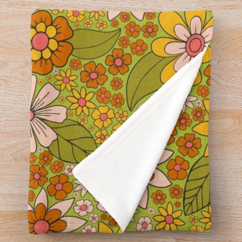 Retro floral flower power plush blanket in green, pink, and orange