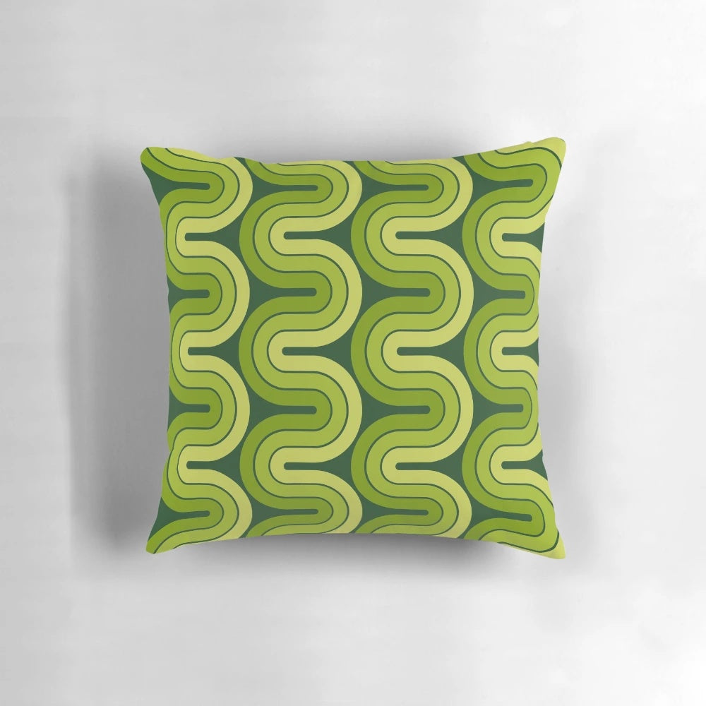 Retro geometric avocado green pillow with a 1960s-inspired pop art design