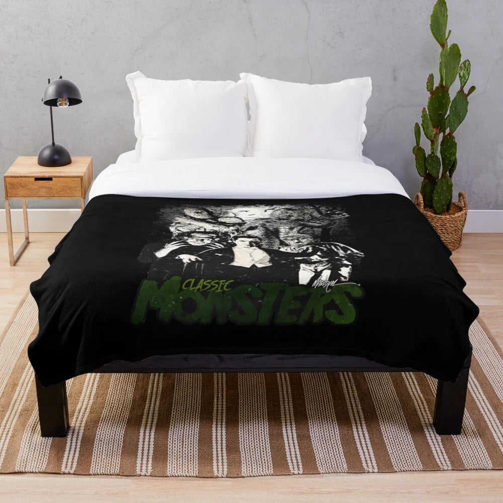 Classic horror movie monsters Dracula, Frankenstein, Wolfman, Mummy on a plush blanket