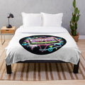 Retro 80s style plush blanket with neon colored cassette tape illustration and geometric patterns