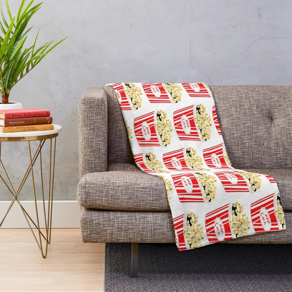 Retro-inspired plush blanket with vintage movie popcorn design